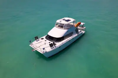 2002 Wright/Lavranos 50 Power Catamaran “Peace”: aerial bow-quarter view of power catamaran showing foredeck, fenders and solar panels on hardtop
