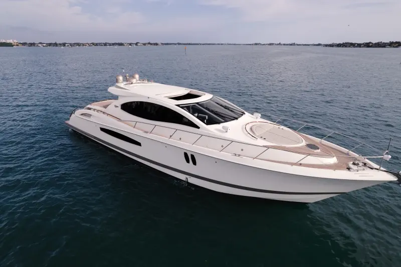 2007 Lazzara Yachts 75 LSX “Salacia”: aerial of white sport yacht at anchor with teak foredeck, round bow sunpad and hardtop