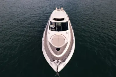 2007 Lazzara Yachts 75 LSX “Salacia”: head-on aerial over the bow showing teak side decks, round sunpad and windshield