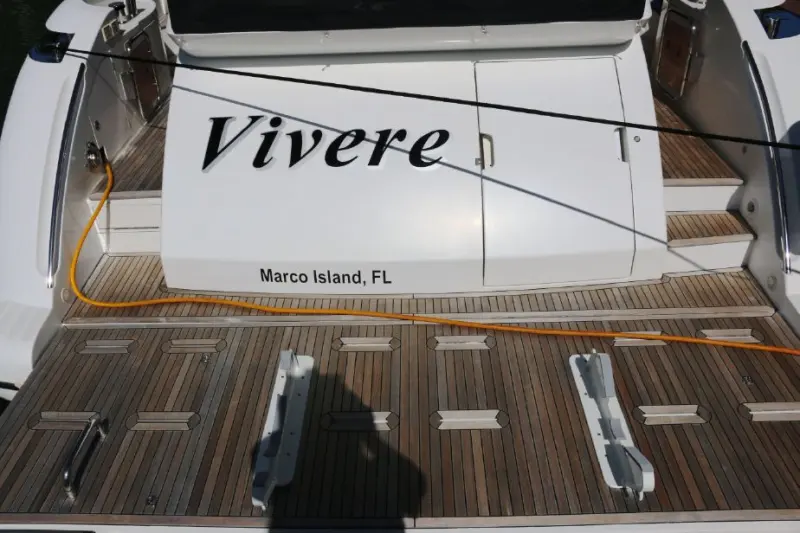 2013 Azimut 64 Flybridge “Vivere”: teak swim platform with tender chocks, transom steps and a shore power cord