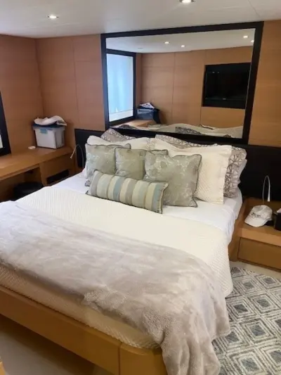 2013 Pershing 64 “Sound View”: stateroom with double berth, oak paneling, large mirror and wall-mounted TV