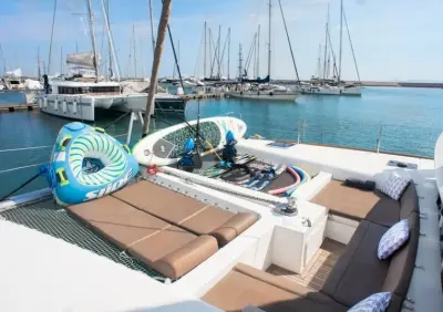2017 Lagoon 450: forward deck with trampoline sunpads, paddleboard, inflatable towable and snorkel gear