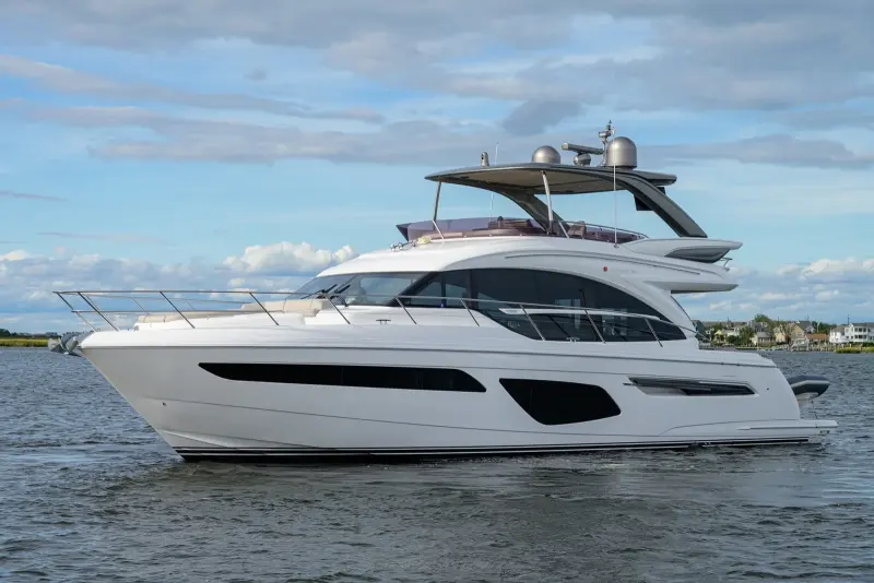 2020 Princess F62 “Quisisana”: flybridge motor yacht at anchor with white hull, long dark hull windows and grey hardtop