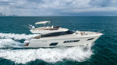 2021 Ferretti Yachts 550 “Haven”: flybridge yacht running at speed, ivory hull with dark hull windows and bow seating